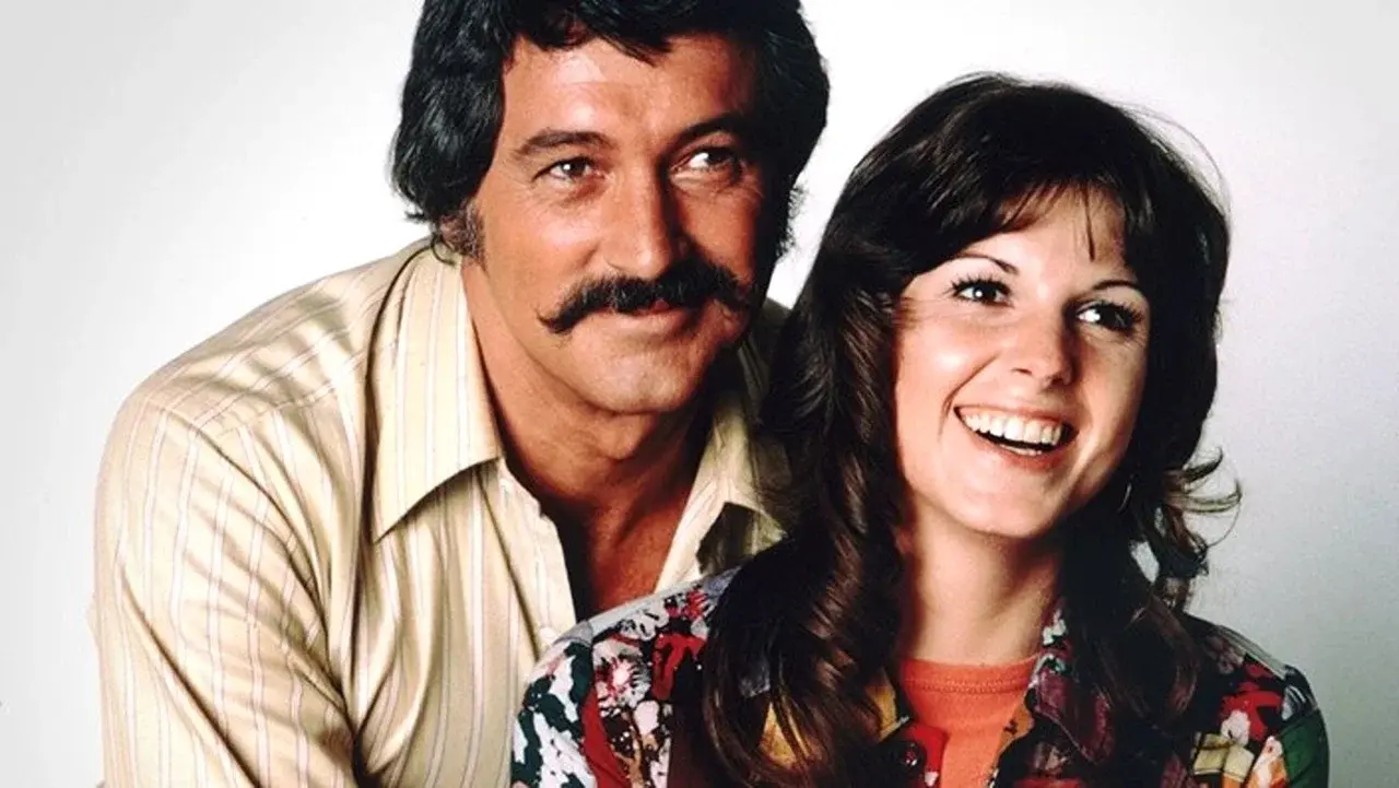 McMillan y esposa fondo